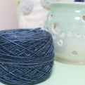 Cake of sparkly blue yarn dyed by Gherkin's Bucket