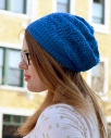 Image of Laura McDougal wearing her Bowdoin Hat on a city street, image copyright Holla Knits